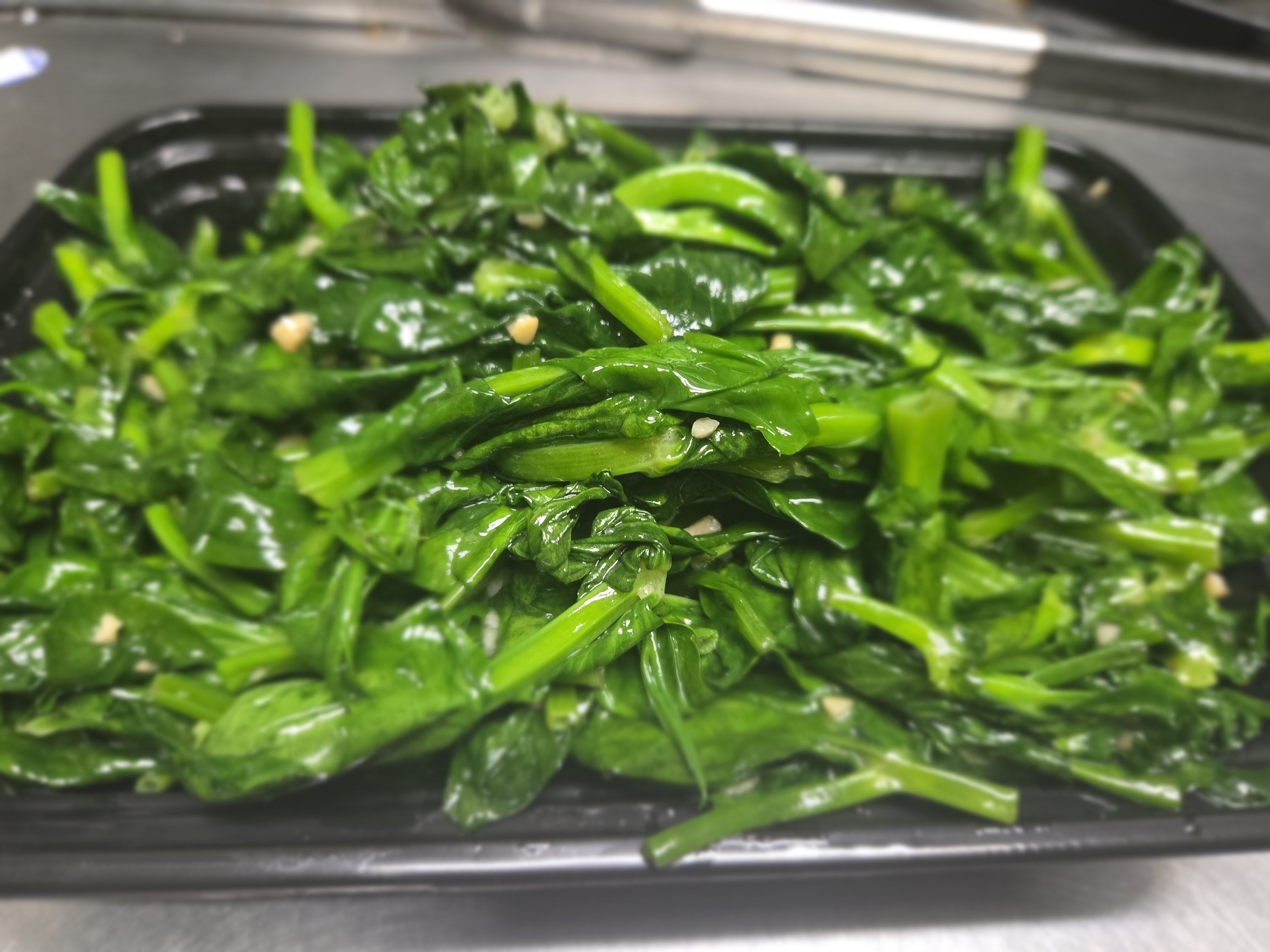 Fresh Snow pea leaves with galica sauce