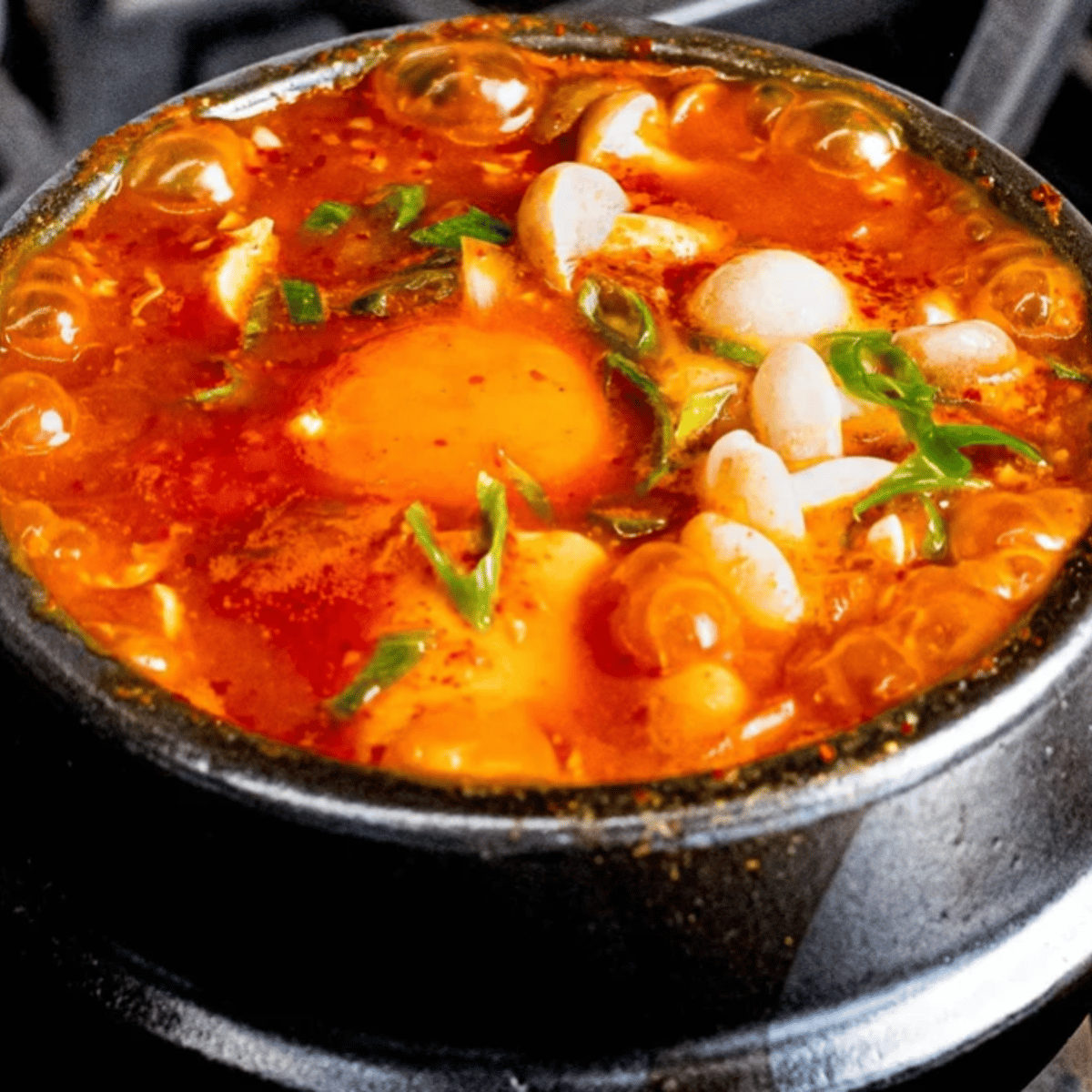 Soondubu(spicy tofu soup) with rice, and choice of 3 sides