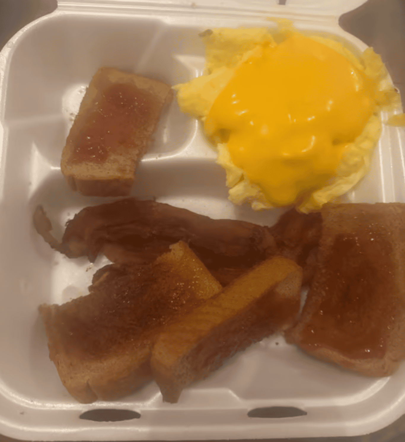 Two Eggs with Choice of Meat, Toast & Jelly