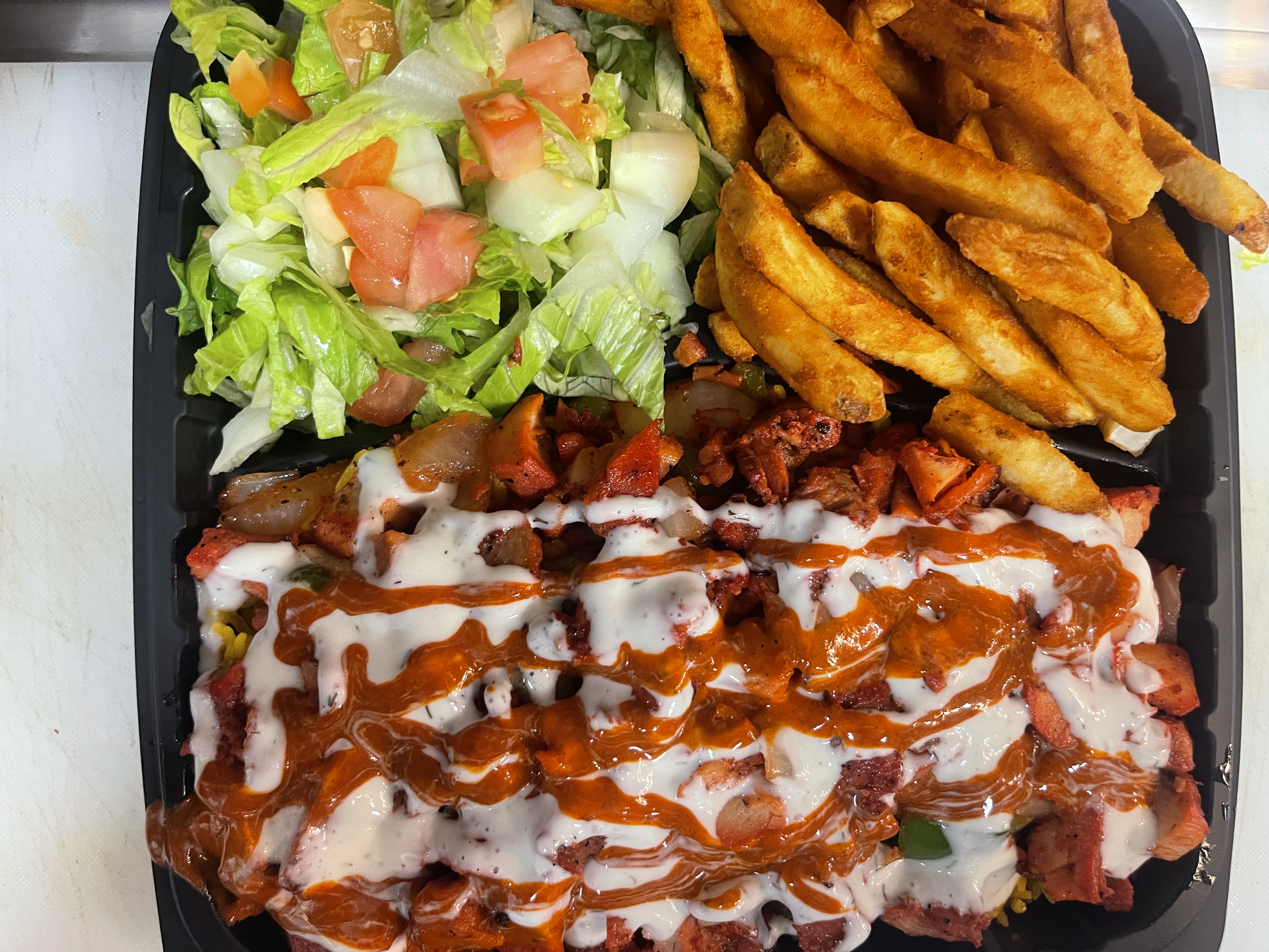 Chicken over rice salad fries