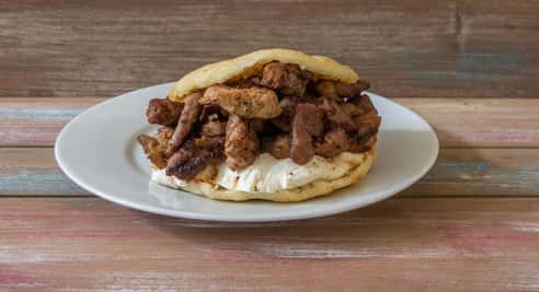 Arepa de Chuleta y Queso Guayanés (Pork Chop and Guayanés Cheese)